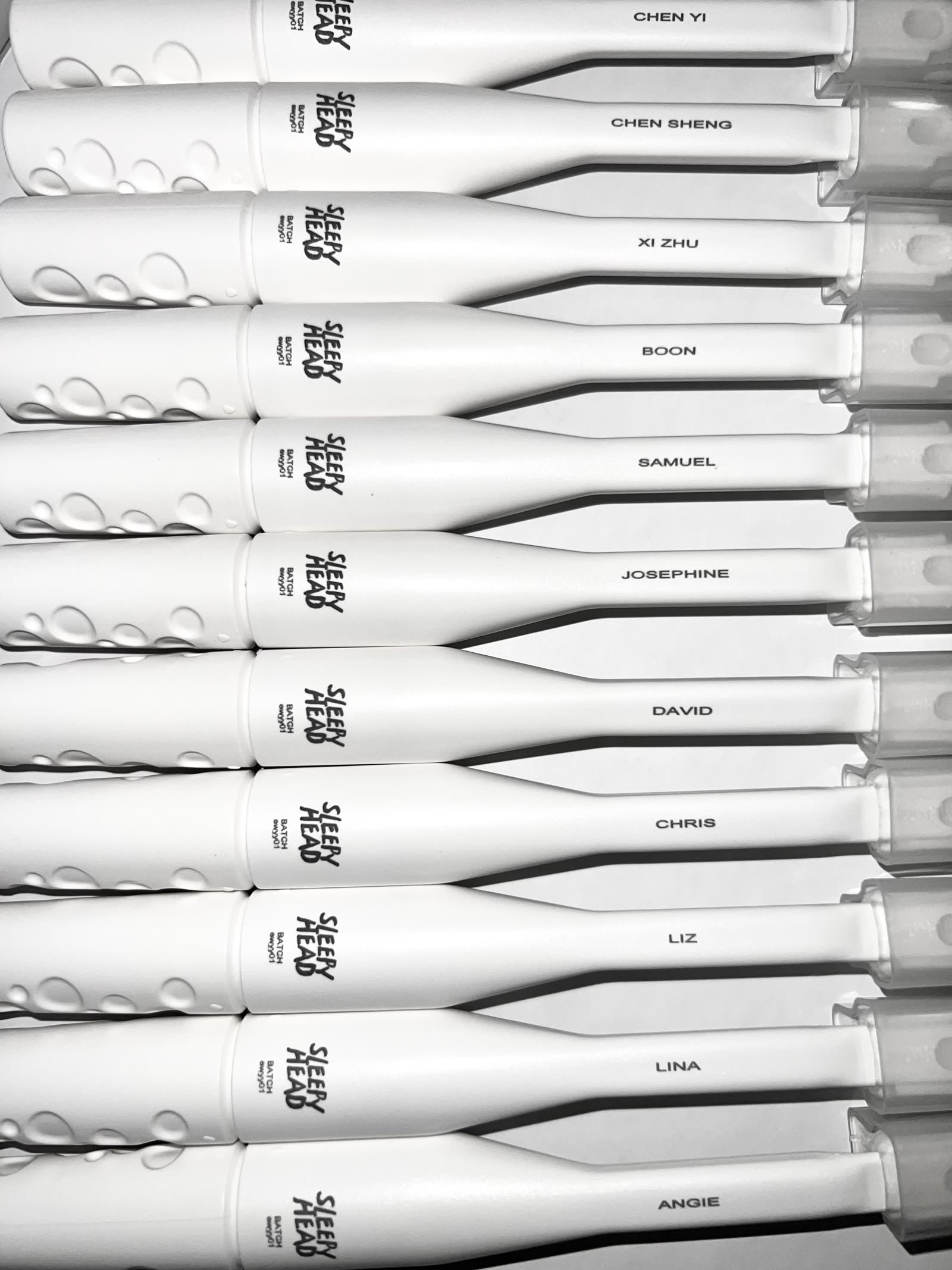 Rows of personalised LUNA 3D+ toothbrushes engraved with individual names